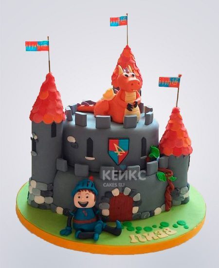 Торт в виде крепости с красной крышей и драконом Торт в виде крепости с красной крышей и драконом Фото