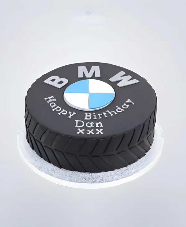 Торт в виде колеса с логотипом БМВ Фото