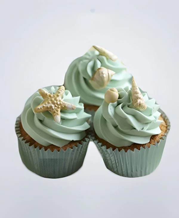 Капкейки в морском стиле со звездой и ракушками Капкейки в морском стиле со звездой и ракушками Фото