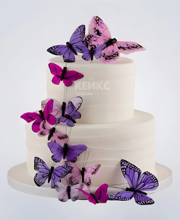 Свадебный торт двухъярусный с яркими бабочками Свадебный торт двухъярусный с яркими бабочками Фото