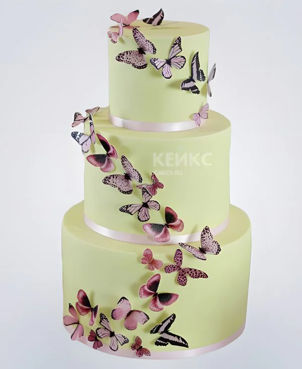 Свадебный торт светло-желтый, обвит бабочками Свадебный торт светло-желтый, обвит бабочками Фото