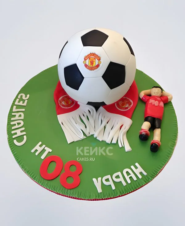 Торт Манчестер Юнайтед с мячом и фигуркой мальчика из мастики Торт Манчестер Юнайтед с мячом и фигуркой мальчика из мастики Фото