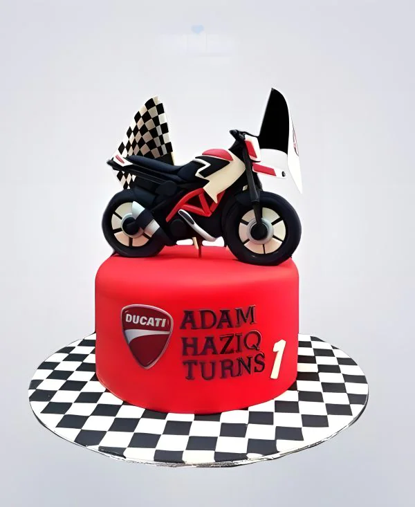 Красный торт с мотоциклом и флажками Фото