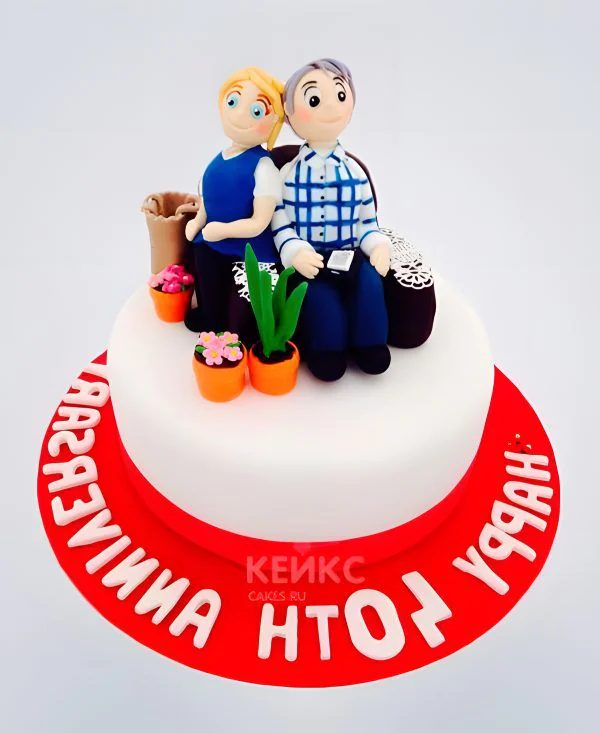 Белый торт с фигурками и красной надписью Белый торт с фигурками и красной надписью Фото