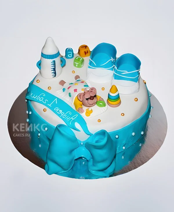 Торт с синим бантом и бутылкой для молока Торт с синим бантом и бутылкой для молока Фото