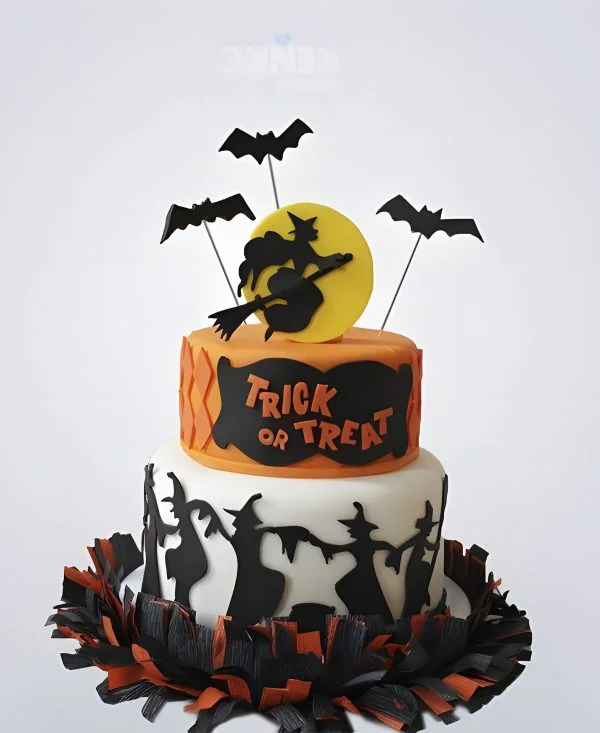 Торт на Хэллоуин с ведьмой на метле Торт на Хэллоуин с ведьмой на метле Фото
