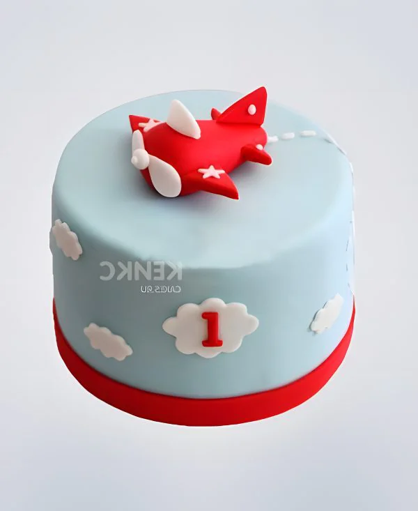 Нежно-голубой торт с красным самолетом в облаках Фото