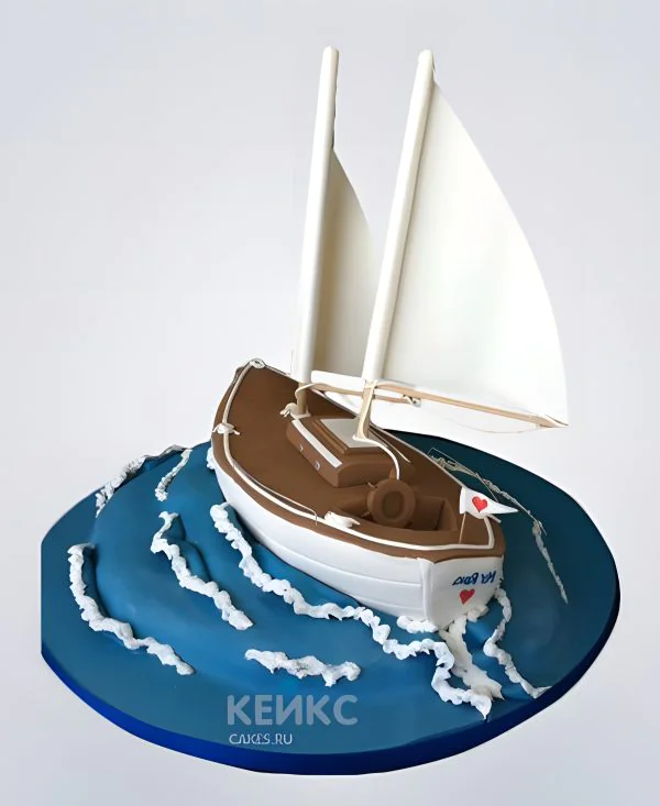 Красивый торт с яхтой в море Красивый торт с яхтой в море Фото