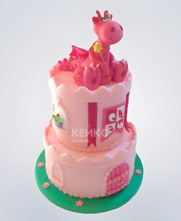 Торт в виде замка с драконом в розовом цвете Торт в виде замка с драконом в розовом цвете Фото
