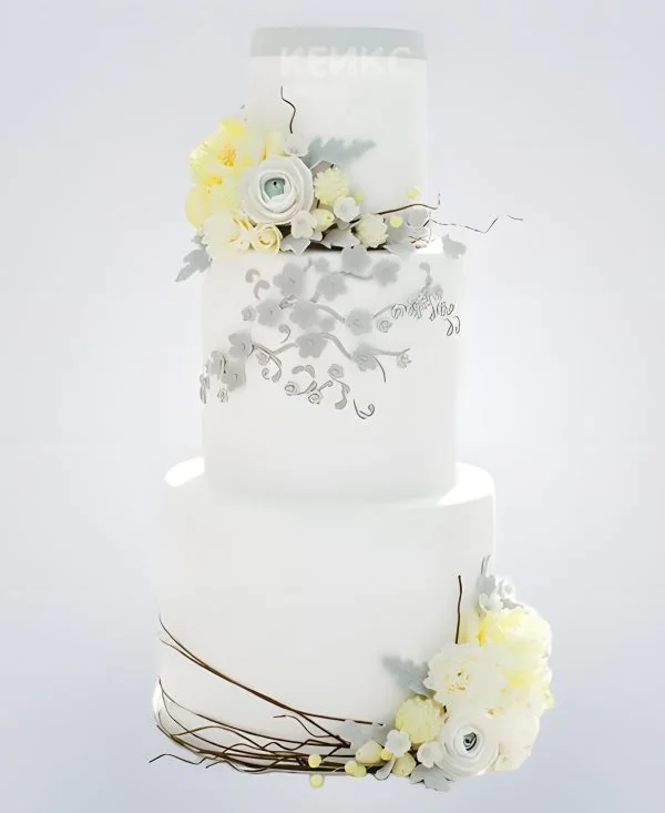 Белый весенний свадебный торт с цветами Белый весенний свадебный торт с цветами Фото
