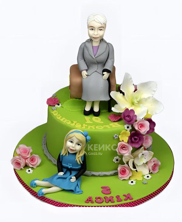 Зеленый торт с цветами с фигурками бабушки и мамы Зеленый торт с цветами с фигурками бабушки и мамы Фото