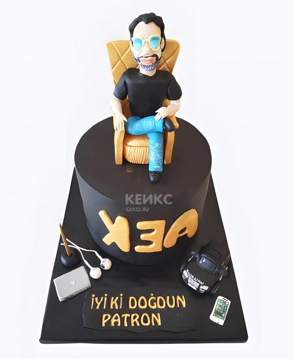 Черный торт с мужчиной в кресле Черный торт с мужчиной в кресле Фото