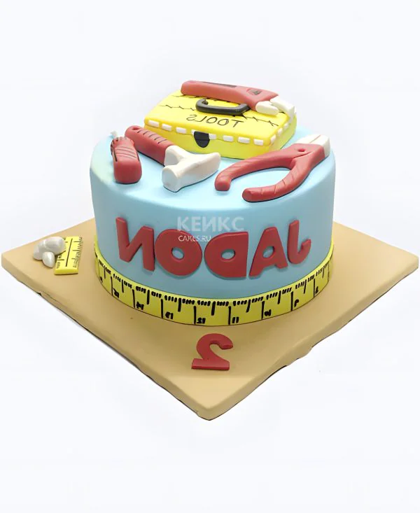 Яркий торт с инструментами Яркий торт с инструментами Фото