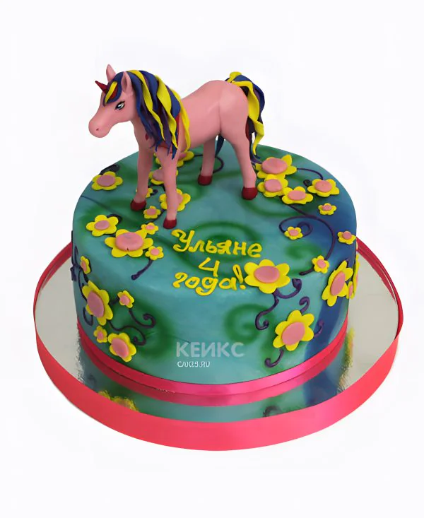 Красивый торт с фигуркой единорога Фото