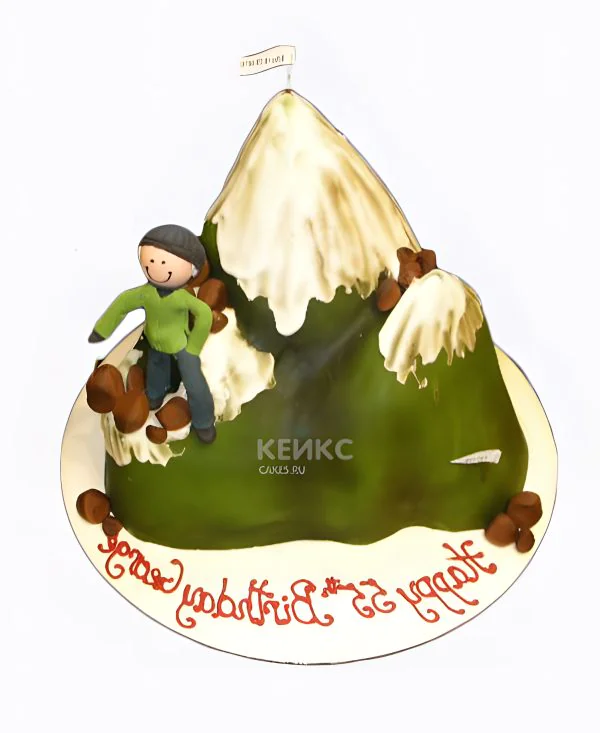 Торт горы в снегу с альпинистом Фото