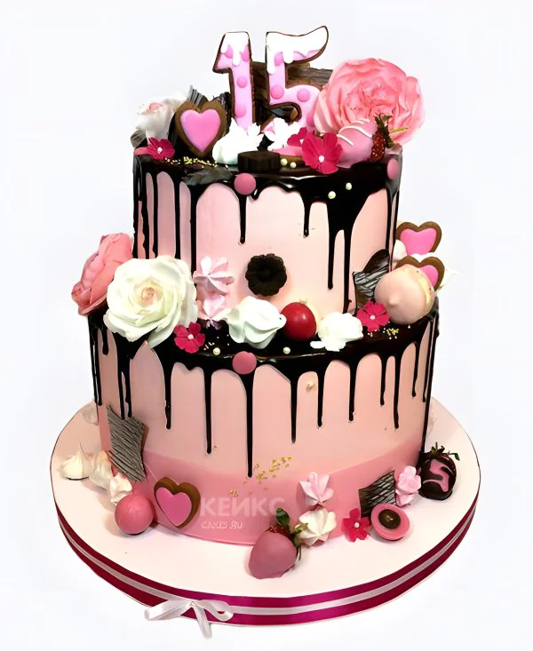 Двухъярусный торт со сладостями и цветами Двухъярусный торт со сладостями и цветами Фото