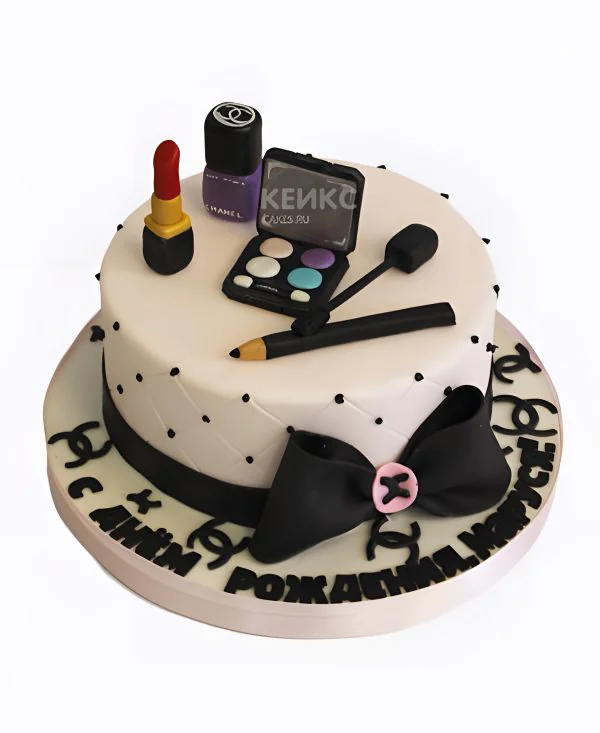 Белый торт с черным бантом и косметикой Белый торт с черным бантом и косметикой Фото