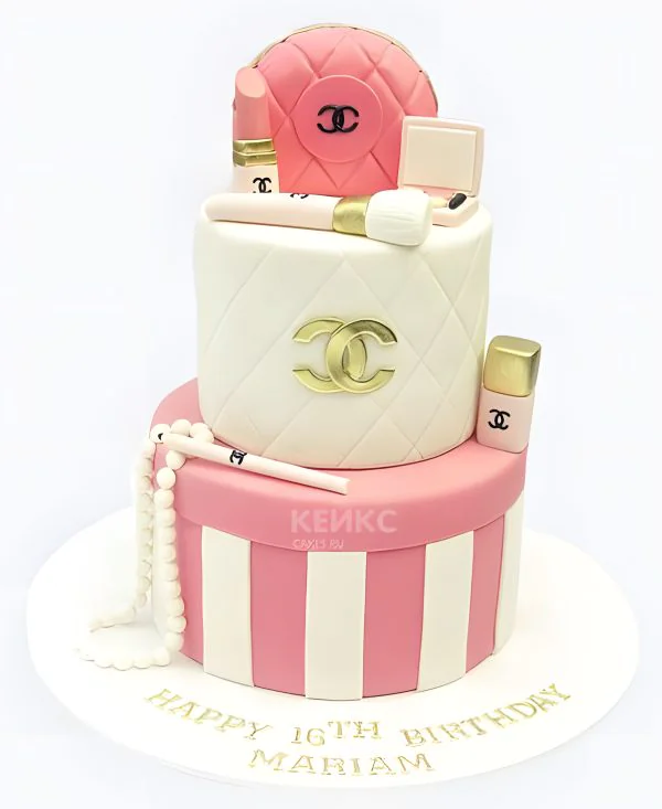 Бело-розовый торт со значком шанель и косметикой Бело-розовый торт со значком шанель и косметикой Фото