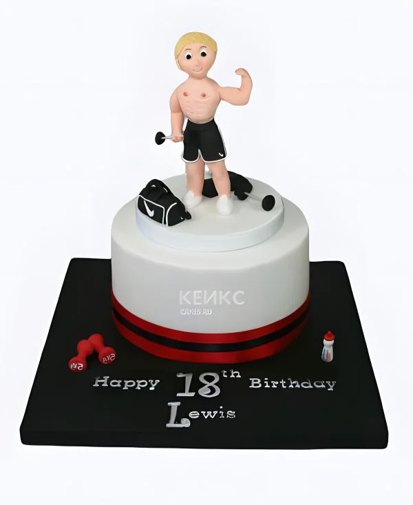Милый белый торт с фигуркой спортсмена Милый белый торт с фигуркой спортсмена Фото