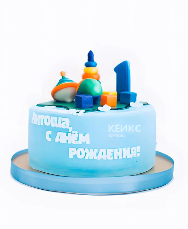 Торт синего цвета и игрушками Торт синего цвета и игрушками Фото