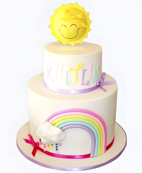 Белый торт с радугой и солнцем Фото