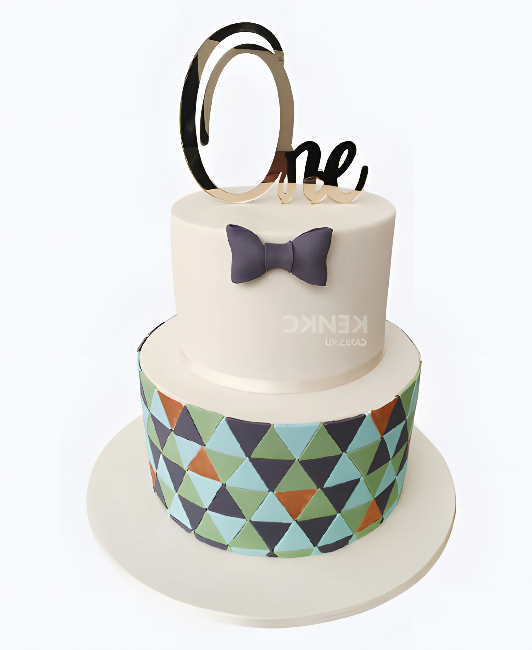 Лаконичный торт с бантиком и геометрическим рисунком Фото