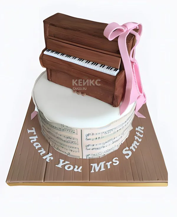 Торт с пианино и розовым бантом Фото