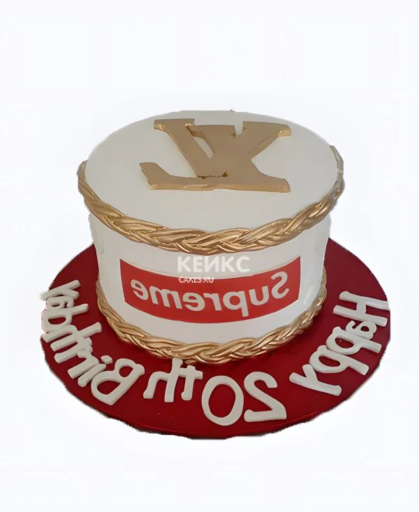 Белый торт с золотым значком Фото