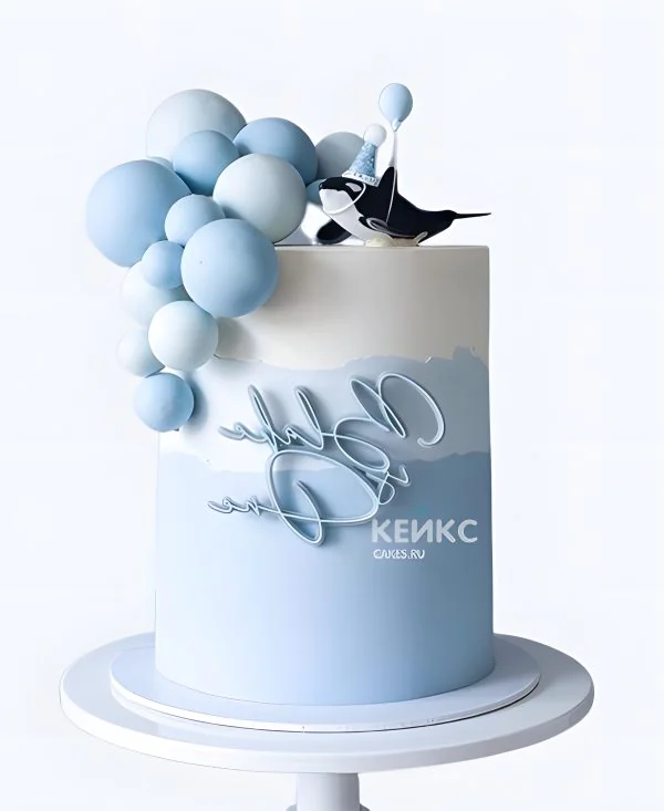 Голубой торт с надписью и китом Фото
