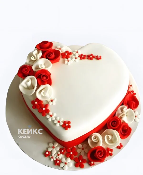 Свадебный торт в виде сердца с цветочками из мастики Свадебный торт в виде сердца с цветочками из мастики Фото