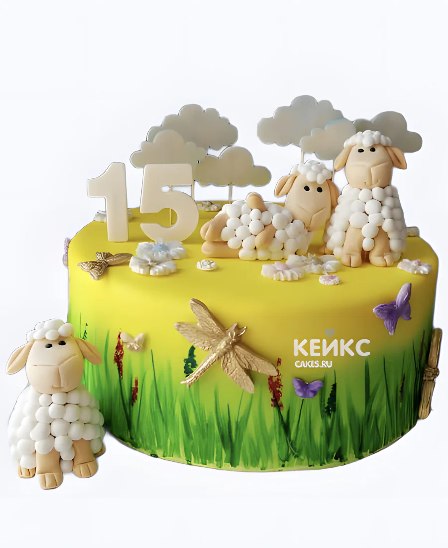 Желтый торт с овечками и зеленой травой Желтый торт с овечками и зеленой травой Фото
