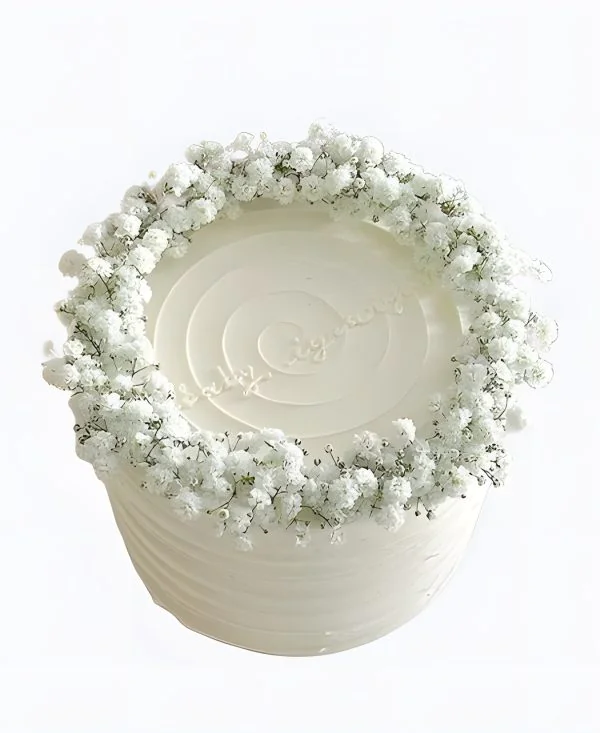 Белоснежный торт с цветочками Фото