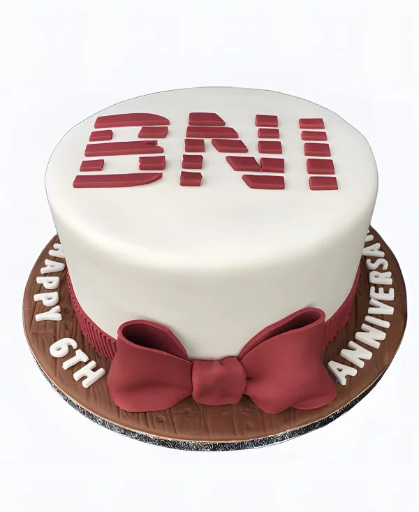 Корпоративный торт с красным бантом Фото