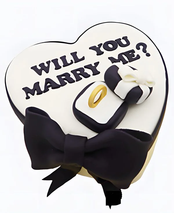 Торт в виде сердца с кольцом и бантом на сватовство Торт в виде сердца с кольцом и бантом на сватовство Фото