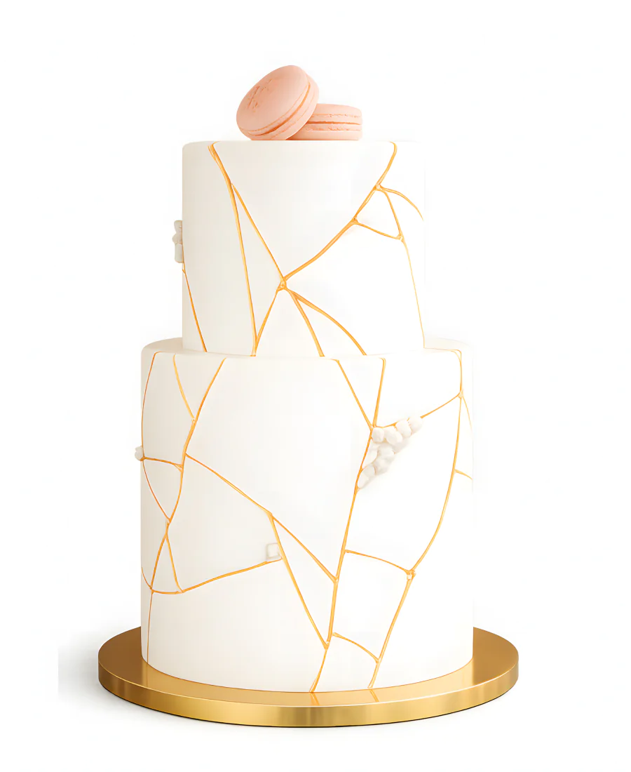 Двухъярусный свадебный торт с мастикой с макарон и узорами из золота Фото