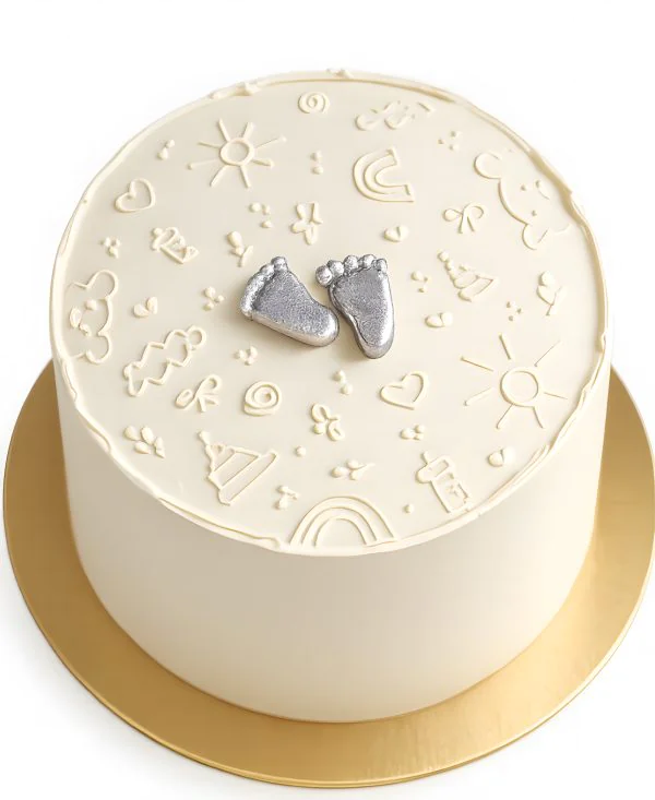 Нежный торт с пяточками младенца Фото