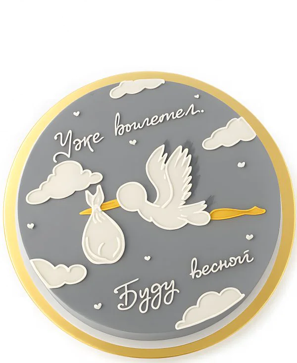 Серый торт с облаками и аистом Фото